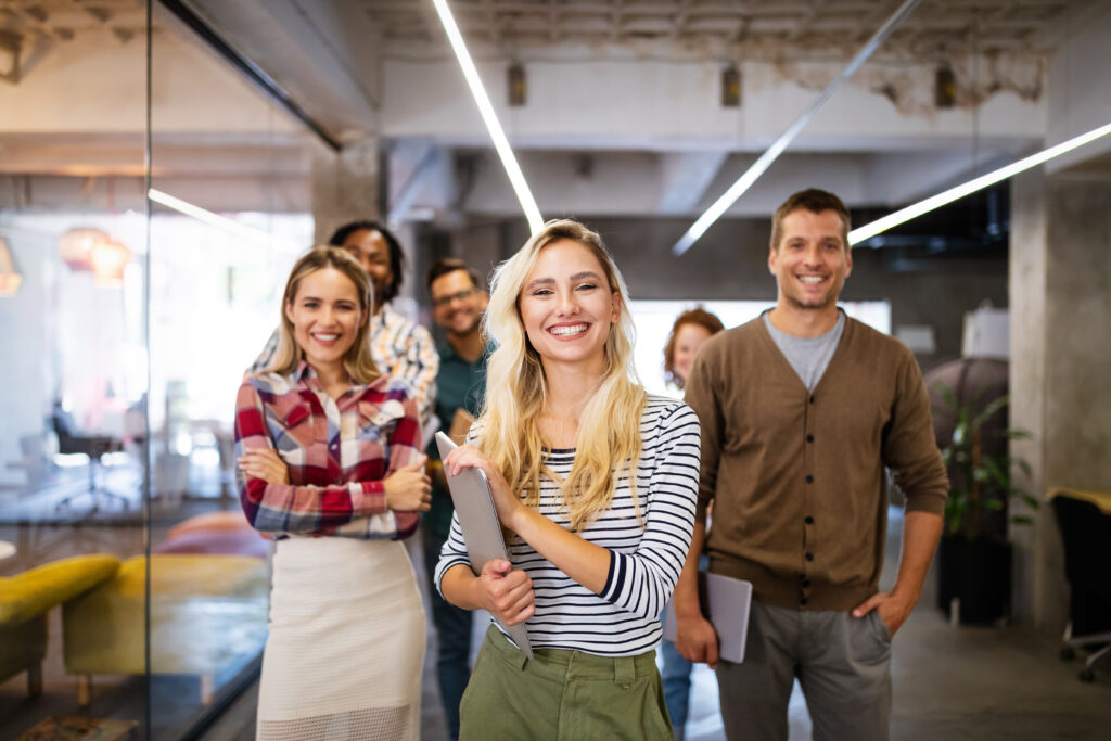 Colleagues standing together in a modern office